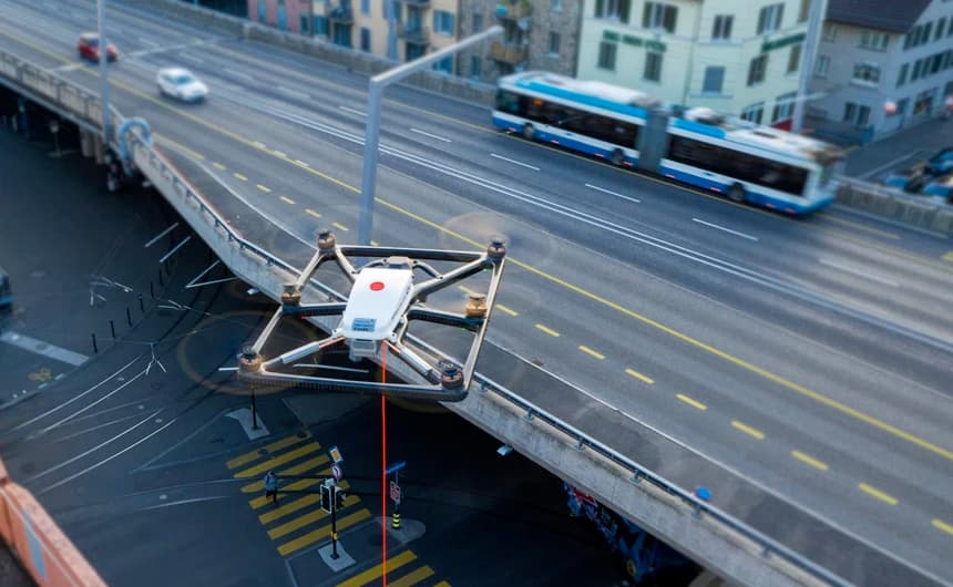 Tethered ATLAS drone with red tether cable deployed over urban infrastructure